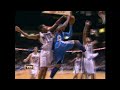 Carmelo Anthony goes up and under the rim, floating by Chris Douglas-Roberts and Brook Lopez, to effortlessly place the ball in the hoop.