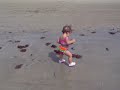 Sydney eating the sand