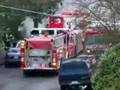 Fire trucks responding to a house fire