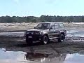 80 Series Landcruiser cruising through water, ruts n mud 80 Series Landcruiser cruising through water, ruts n mud