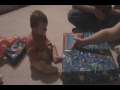 Jake opening a present at christmas.
