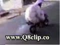 crazy man driving a littil motor cycle