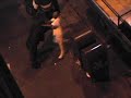 A film student at City College hangs out the front window of his Tenderloin SRO and videos a fight down on the street below. Camera is one of the first JVC cigarette pack size mini DV camcorders which took the world by storm circa 1998.