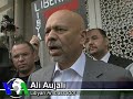 Despite Defections, Libyan Leader Vows to Fight on