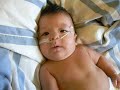 Preemie smiles and coos at mommy