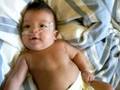 Preemie smiles and coos at mommy