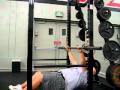 2010-05-26 | BENCH PULLS ~> Athlete performs inverted rowing exercise using a barbell inside a squat rack. ... fitness ... ()