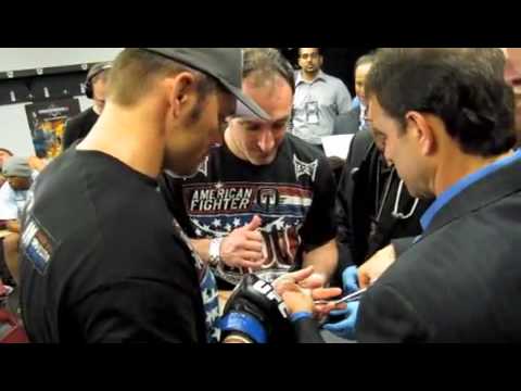 Rich Franklin in Pain removing Gloves after breaking arm vs Chuck Liddell