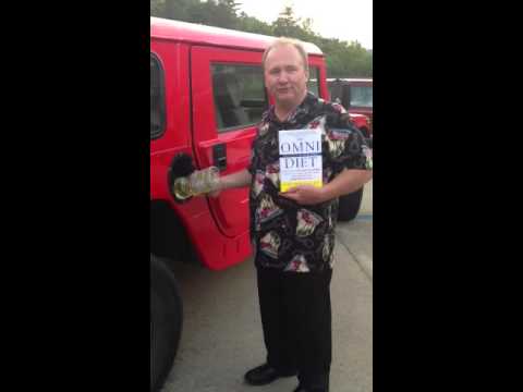 Mike putting cooking oil in the Hummer