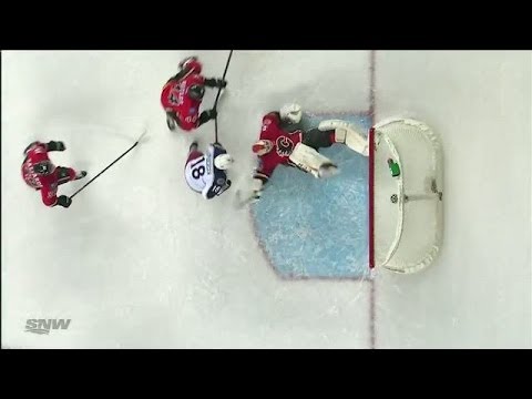 save - Calgary Flames goalie Reto Berra makes a ridiculous bicycle kick style save to stop Columbus Blue Jackets defenseman Jack Johnson.