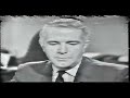 this is part 2 of a 12 part program about the death and burial of president kennedy in november of 1963. this section starts with walter cronkite reporting on the shooting, and then the footage has dan rather doing narration. there are scenes at parkland memorial hospital where president john f. kennedy was taken with his wife first lady jacqueline kennedy by his side. governor john b. connally is also mentioned as being shot with president kennedy.  mentioned also in this section is sarah t. hughes, who administered the oath of office to president lyndon baines johnson.  charles collingwood also speaks in this section, as in the original footage he takes over about 10 minutes after walter cronkite announced the death of the president. there are scenes of the texas school book depository also, as well as lee harvey oswald being escorted into the dallas city police department. harry reasoner is also in this part. dr. robert shaw (governor connally's surgeon)is also seen speaking at a press conference describing the wounds of governor john connally, and surmising what direction they came from.  love field airport in dallas, texas is also seen, and at the end of the clip andrews air force base in bethesda, maryland is in view as air force one lands carrying president kennedy's body from dallas. in the last part of the section  dave powers, larry o brien, robert kennedy, jacqueline kennedy,kenny o donnell mary barelli, evelyn lincoln, william greer, roy kellerman and godfrey mchugh are seen around the navy ambulance.