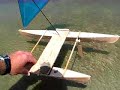 Show two ways of adjusting center of lateral hull area to gain neutral helm balance. First run with weight aft on leeward hull . Second run with board down no weight on leeward hull.