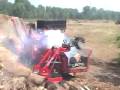 T-Rex Attachment loading woodhog with large logs
