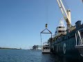 Crane Lifting 52 Foot Bayliner Aboard Freighter