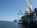 Crane Lifting 52 Foot Bayliner Aboard Freighter