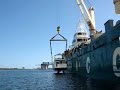 Crane Lifting 52 Foot Bayliner Aboard Freighter