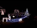 Jingle Bells - Island Style, a new Christmas classic. Jingle Bells with the Steel Drum Band! 30,000 lights make up this winter wonderland with sparkling trees, snow, deer and snowflakes. Look for the little angel corgi, Sam...shining brightly to greet all!!This display is created using 56 channels of Light-O-Rama controls.  An FM transmitter made it possible for visitors to stay in their vehicles while watching the display.  This is one of 7 songs that were created using Light-O-Rama.  See last year's (2006) YouTube video for the Carol of the Bells display. Happy Holidays and Season's Greetings!