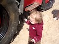 Grayson exploring a big tire at the beach