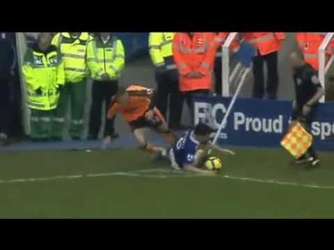 Linesman gets taken out by the corner flag