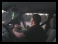 Crazy dudes swinging with their socks outside a car window!