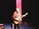 This is a camcorder registration of a live performance by Tommy Emmanuel in The Netherlands 2004. The location is Raalte, the Hoftheatre. (Het Hoftheater) It's a small (200 people) venue, and organized by guitar enthousiasts from that village. Tommy Emmanuel had performed a few years already in the Netherlands, (thanks to Dim van Gerven, Zaandam) and was getting more-and-more attention year-by-year. Maybe his growing fame will keep him out of these small venues, so this is a nice opportunity to watch him how he was back than in 2004. Camcorder quality is poor I must admit (I'm zooming in on the digital footage) but just watch the great playing, feel, and technique of the master and just enjoy this evening as much as I did.