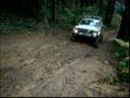 Jeep Cherokee climbs slippery steep hill