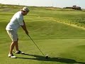 Bond tees off on the 18th at Harborside