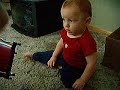 Baby learns bongos