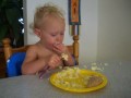 Sophie eating with a fork