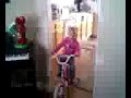 Canyon riding her bike inside the house.