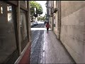 Lissabon's famous Tram 28 climbing up the narrow Streets of Alfama