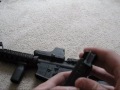 This is my DPMS AR-15 with Magpul vertical grip, Magpul flip up rear sight, EOTech 552 holographic weapon sight, Magpul PMAG magazine, Hogue grip, 2 piece quad rail, single point sling mount and sling and extended latch on the charging handle.