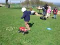 lina, pablo and friends are playing with a r/c truck during easter picknic.