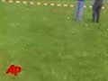 a small plane crashes at an air show in germany, the landing caught on amateur video. the plane struck people, a candy stand and a carousel, killing one person and injuring 10 others, including children. (april 27)