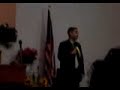 Robero Lugo preaching about his experiences after the mall