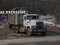 The regulation's logical conclusion is that the material----waste, liquid, cover soil, road mud or whatever else that exits the landfill on the undercarriage of the truck, or the truck tires or the 