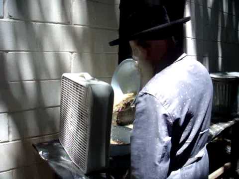 Serdahel Rebbe wind shovling wheat for Matzos of Pesach 5771