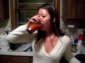 girl drinks siracha hot sauce for coke