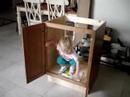 brianna in bathroom cabinet