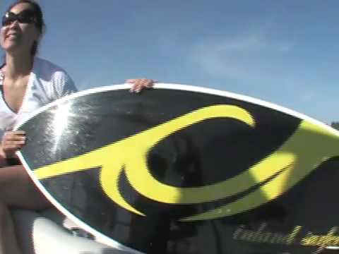 Grace riding behind a Centurion on Inland Surfer board