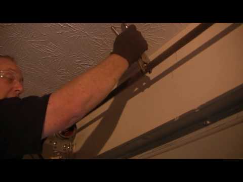 how to repair the spring on a garage door