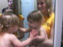 baby givin kisses to herself