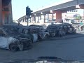 cars burnt after benazir's assasination in karachi's nipa and aladdin areas