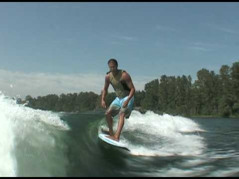 Lance riding behind a Centurion on Inland Surfer Blue Lake board