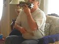 Dad playing his mouth organ.