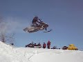 Snowmobile whips, road gaps, drops, and other fine maneuvers Snowmobile whips, road gaps, drops, and other fine maneuvers
