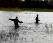 Amy & Phil Wading in the Water
