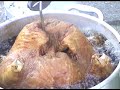 Pulling A Turkey Out Of The Deep Fryer