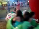 Austin, Allee, and Vinny On The Lady Bug At a Carnival