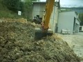 loading truck with Komatsu PC 210 NLC excavator